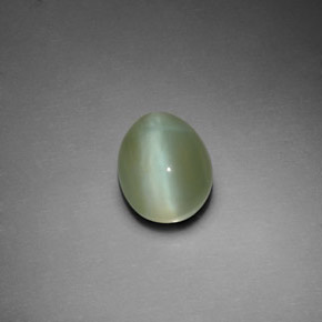 Натуральный зелёный actinolite cat's eye 3,02 карата огранка овал, прозрачный