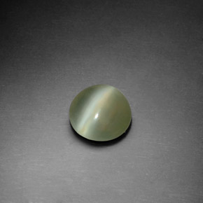 Натуральный зелёный actinolite cat's eye 1,22 карата огранка круг, прозрачный