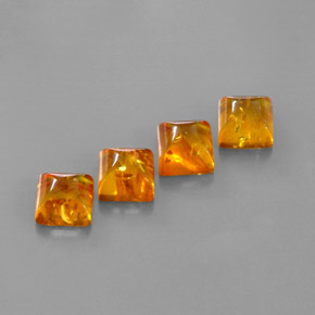 Натуральный оранжевый янтарь  карата прозрачный, полупрозрачный