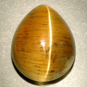 Натуральный жёлтый cat's eye apatite 4,94 карата прозрачный, полупрозрачный