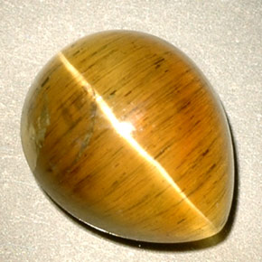 Натуральный жёлтый cat's eye apatite 4,94 карата прозрачный, полупрозрачный