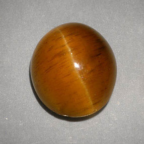 Натуральный жёлтый cat's eye apatite 5,05 карата прозрачный, полупрозрачный