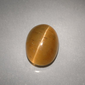 Натуральный жёлтый cat's eye apatite 3,94 карата прозрачный, полупрозрачный