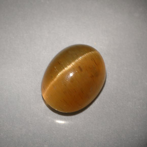 Натуральный жёлтый cat's eye apatite 3,94 карата прозрачный, полупрозрачный
