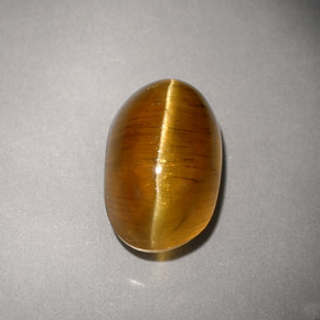 Натуральный жёлтый cat's eye apatite 4,93 карата прозрачный, полупрозрачный
