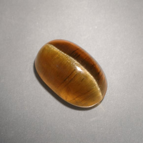 Натуральный жёлтый cat's eye apatite 4,93 карата прозрачный, полупрозрачный