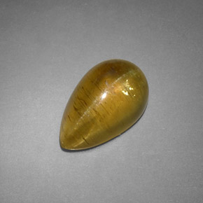 Натуральный жёлтый cat's eye apatite 4,09 карата прозрачный, полупрозрачный