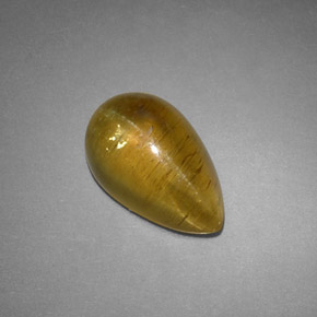 Натуральный жёлтый cat's eye apatite 4,09 карата прозрачный, полупрозрачный