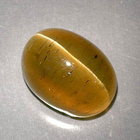Натуральный жёлтый cat's eye apatite 3,32 карата огранка овал, полупрозрачный
