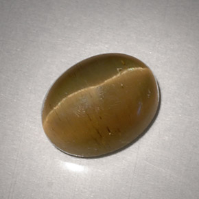 Натуральный жёлтый cat's eye apatite 3,11 карата огранка овал, полупрозрачный