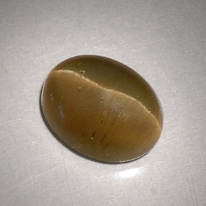 Натуральный жёлтый cat's eye apatite 3,11 карата огранка овал, полупрозрачный
