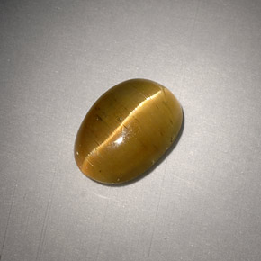 Натуральный жёлтый cat's eye apatite 3,01 карата огранка овал, полупрозрачный