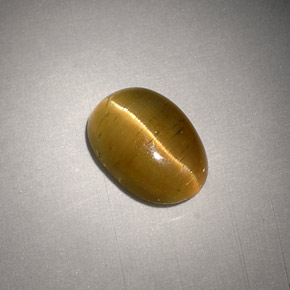 Натуральный жёлтый cat's eye apatite 3,01 карата огранка овал, полупрозрачный