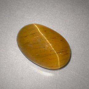 Натуральный жёлтый cat's eye apatite 2,48 карата огранка овал, полупрозрачный