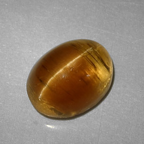 Натуральный жёлтый cat's eye apatite 3,32 карата огранка овал, полупрозрачный