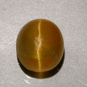 Натуральный жёлтый cat's eye apatite 1,90 карата огранка овал, полупрозрачный