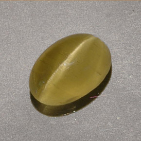 Натуральный жёлтый cat's eye apatite 1,40 карата огранка овал, полупрозрачный