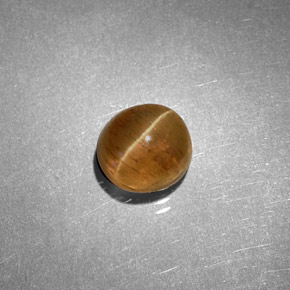 Натуральный жёлтый cat's eye apatite 1,61 карата огранка овал, полупрозрачный
