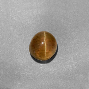 Натуральный жёлтый cat's eye apatite 1,61 карата огранка овал, полупрозрачный