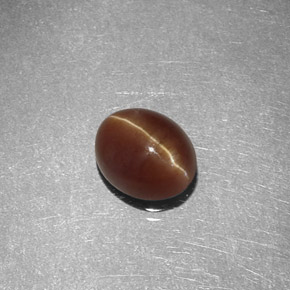 Натуральный жёлтый cat's eye apatite 1,47 карата огранка овал, полупрозрачный