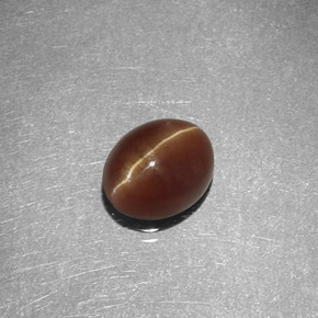 Натуральный жёлтый cat's eye apatite 1,47 карата огранка овал, полупрозрачный