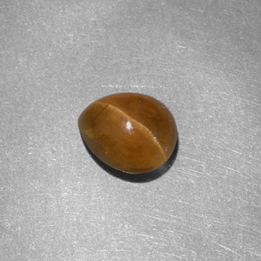 Натуральный жёлтый cat's eye apatite 1,46 карата форма груши, полупрозрачный