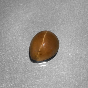 Натуральный жёлтый cat's eye apatite 1,46 карата форма груши, полупрозрачный