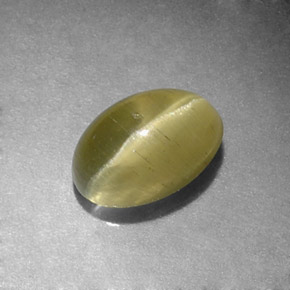 Натуральный зелёный cat's eye apatite 1,31 карата огранка овал, полупрозрачный
