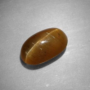 Натуральный жёлтый cat's eye apatite 2,44 карата огранка овал, полупрозрачный