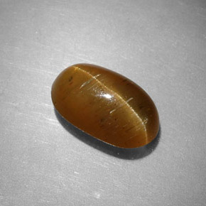Натуральный жёлтый cat's eye apatite 2,44 карата огранка овал, полупрозрачный