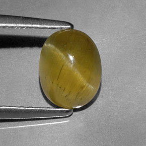 Натуральный золотисто-зеленый апатит кошачий глаз 1,44 карата прозрачный, полупрозрачный