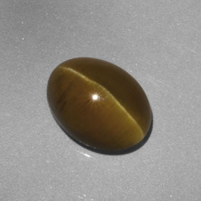 Натуральный жёлтый cat's eye apatite 3,52 карата прозрачный, полупрозрачный