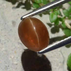 Натуральный коричневый cat's eye apatite 1,91 карата огранка овал, полупрозрачный