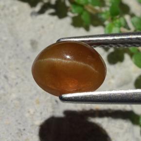 Натуральный коричневый cat's eye apatite 1,91 карата огранка овал, полупрозрачный
