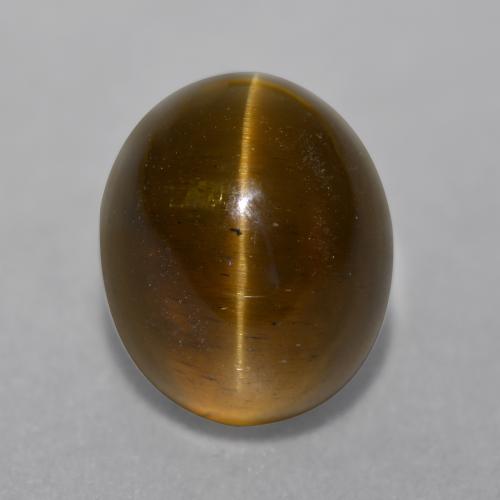 Натуральный коричневый cat's eye apatite 7,22 карата огранка овал, полупрозрачный