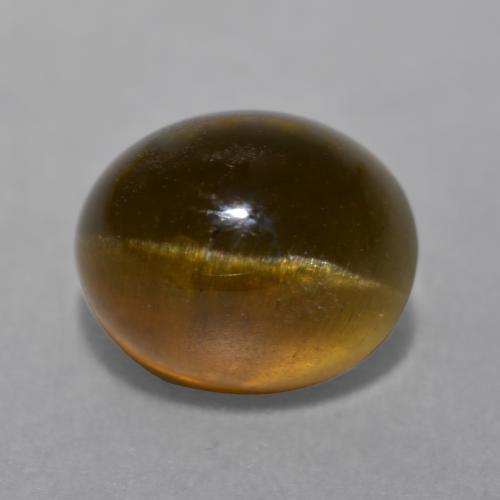 Натуральный коричневый cat's eye apatite 7,22 карата огранка овал, полупрозрачный