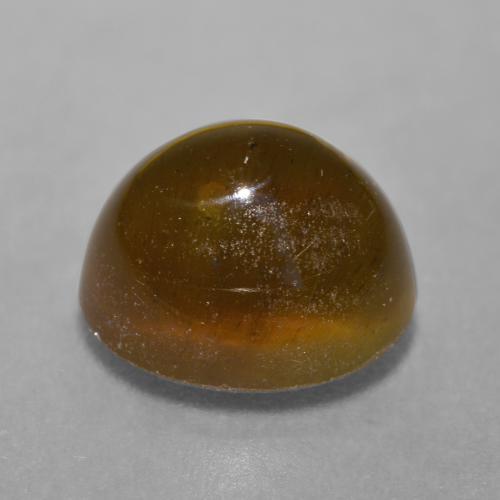 Натуральный коричневый cat's eye apatite 7,22 карата огранка овал, полупрозрачный