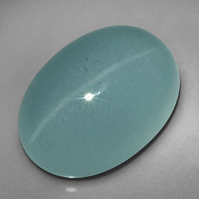 Натуральный зелёный cat's eye aquamarine 12,39 карата прозрачный, полупрозрачный