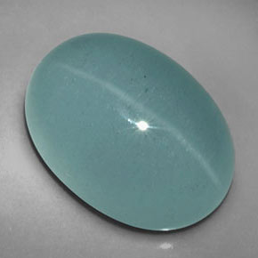 Натуральный зелёный cat's eye aquamarine 12,39 карата прозрачный, полупрозрачный