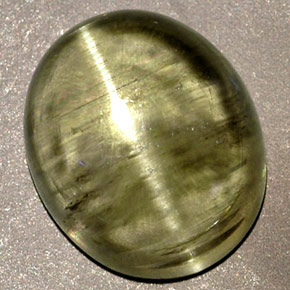 Натуральный зелёный cat's eye diaspore 6,32 карата прозрачный, полупрозрачный
