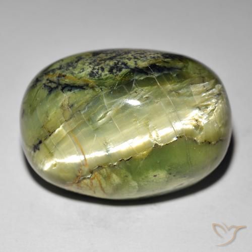 Натуральный зелёный cat's eye opal 35,49 карата огранка овал, непрозрачный