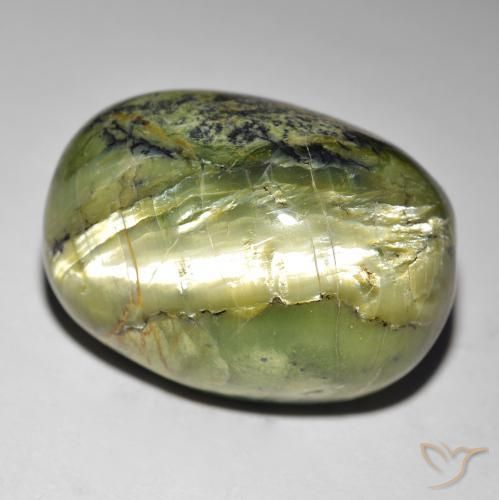 Натуральный зелёный cat's eye opal 35,49 карата огранка овал, непрозрачный