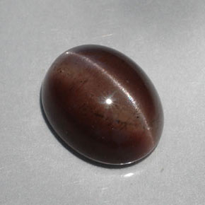 Натуральный коричневый cat's eye scapolite 5,30 карата огранка овал, полупрозрачный