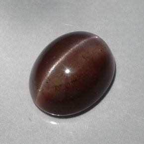 Натуральный коричневый cat's eye scapolite 5,30 карата огранка овал, полупрозрачный