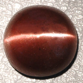 Натуральный коричневый cat's eye scapolite 4,26 карата огранка овал, непрозрачный