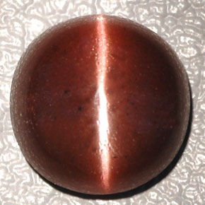 Натуральный коричневый cat's eye scapolite 4,26 карата огранка овал, непрозрачный