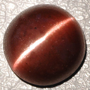 Натуральный коричневый cat's eye scapolite 4,26 карата огранка овал, непрозрачный