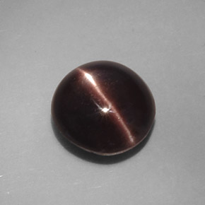 Натуральный коричневый cat's eye scapolite 3,46 карата огранка овал, непрозрачный