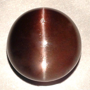 Натуральный коричневый cat's eye scapolite 11,06 карата огранка круг, полупрозрачный