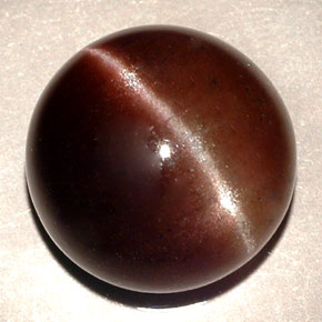 Натуральный коричневый cat's eye scapolite 11,06 карата огранка круг, полупрозрачный